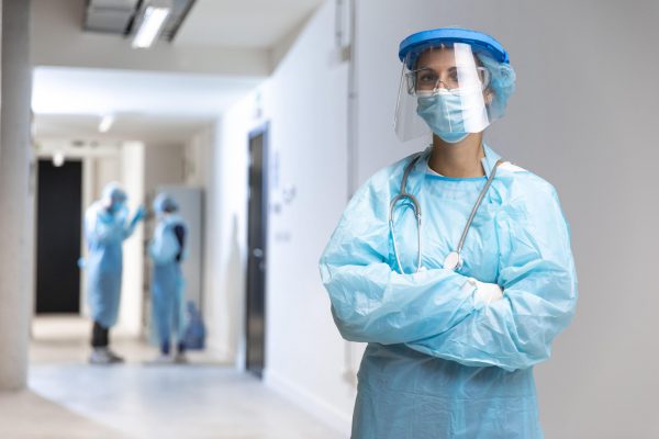 front-view-woman-wearing-protective-wear-in-the-hospital